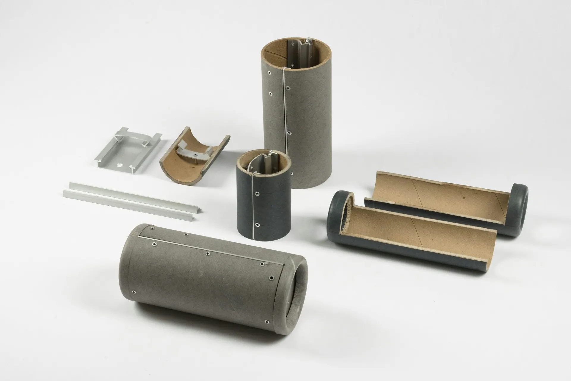 Cardboard and metal prototype components on white